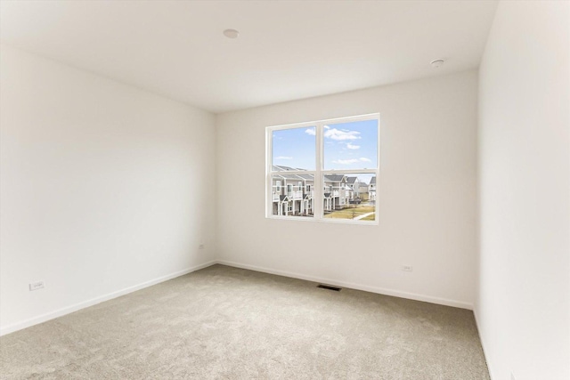 spare room featuring carpet flooring