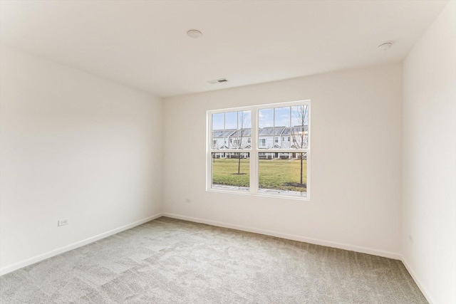 spare room with light carpet