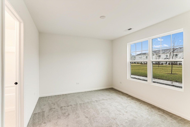 empty room featuring light colored carpet