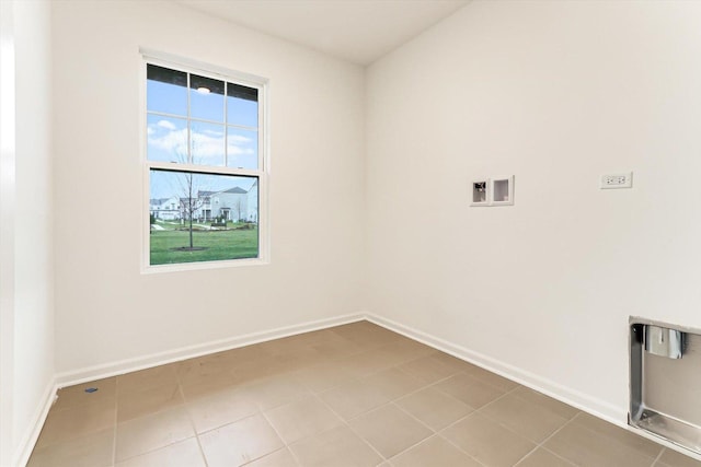 laundry area featuring washer hookup and tile patterned flooring