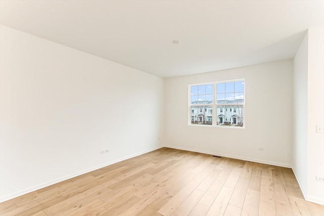 spare room featuring light hardwood / wood-style floors