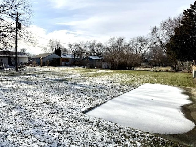 view of yard layered in snow