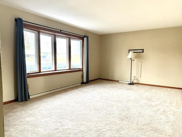 empty room with carpet and a baseboard radiator