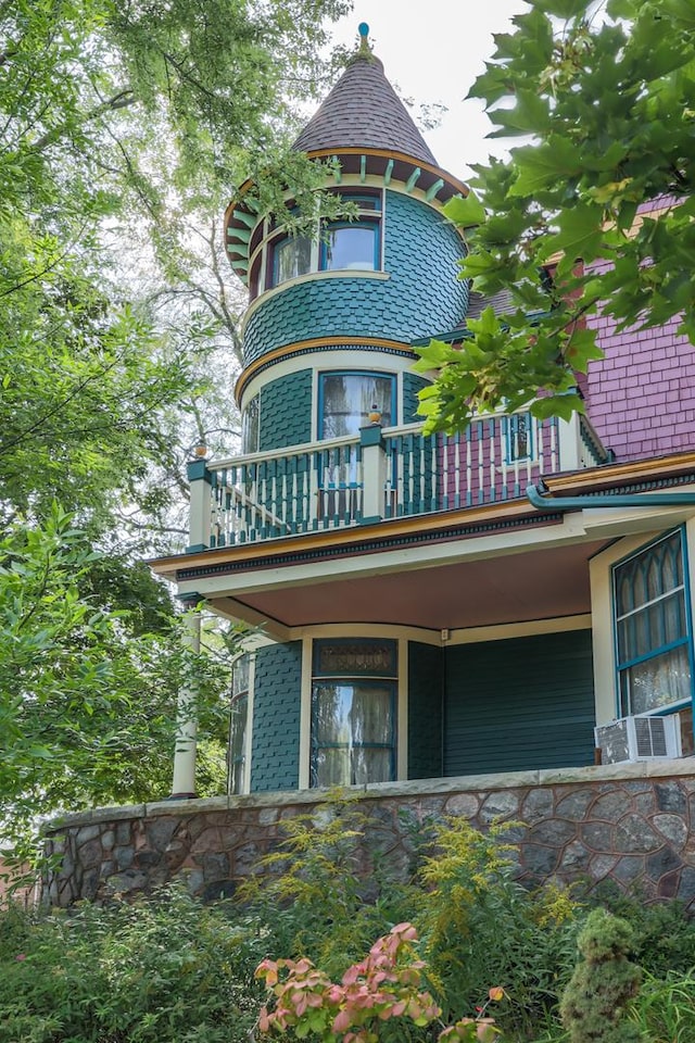 rear view of property with a balcony