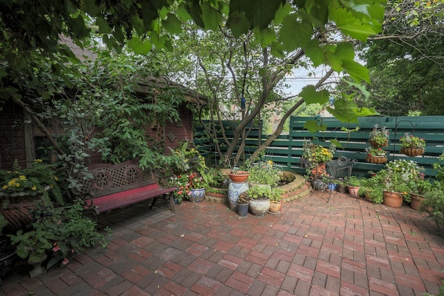 view of patio / terrace featuring fence