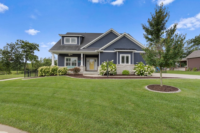 craftsman-style house with a front yard