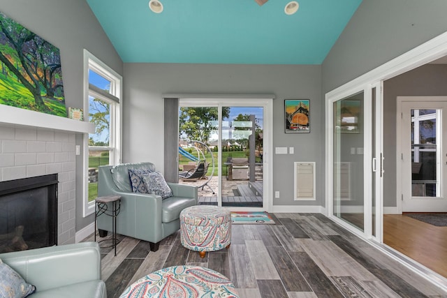 interior space featuring a fireplace and vaulted ceiling