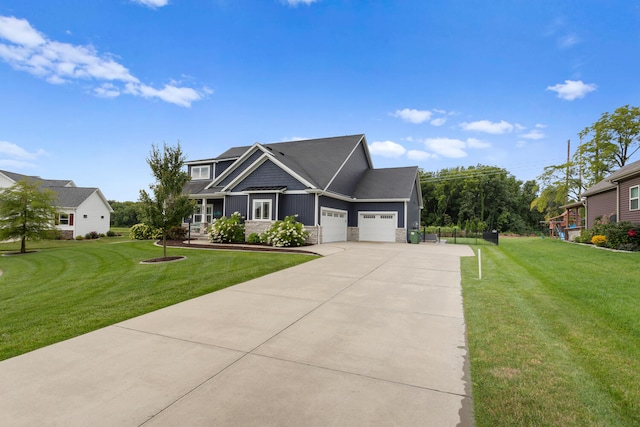 view of front of property with a garage and a front yard