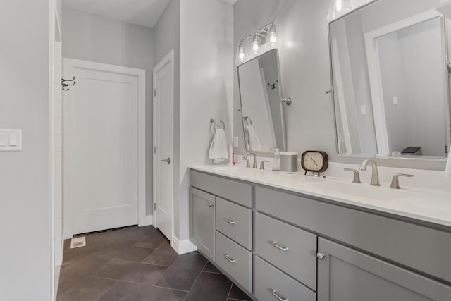 bathroom with tile patterned floors and vanity