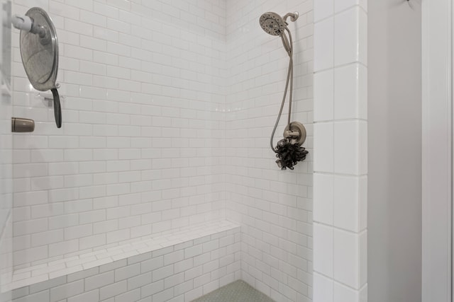 bathroom featuring a tile shower