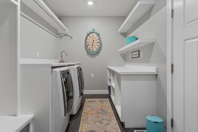 laundry room featuring washer and clothes dryer and sink