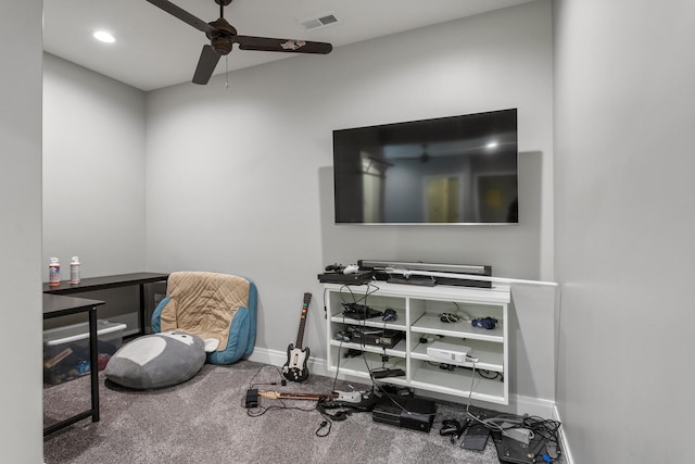 interior space featuring carpet and ceiling fan