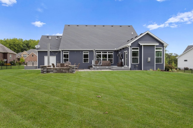 rear view of house with a yard and a patio