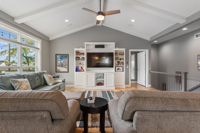 living room featuring ceiling fan, lofted ceiling with beams, and light hardwood / wood-style floors