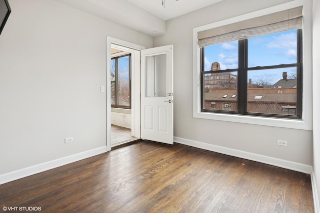 unfurnished bedroom featuring dark wood-type flooring