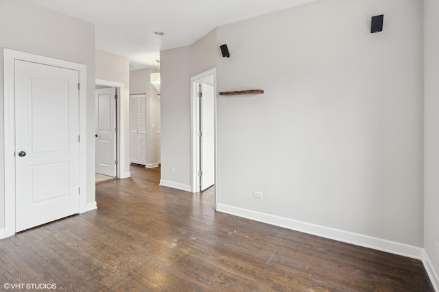 spare room featuring dark hardwood / wood-style floors