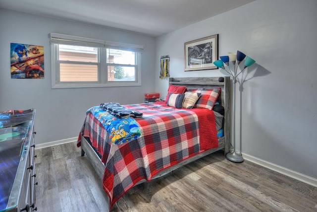 bedroom with hardwood / wood-style flooring