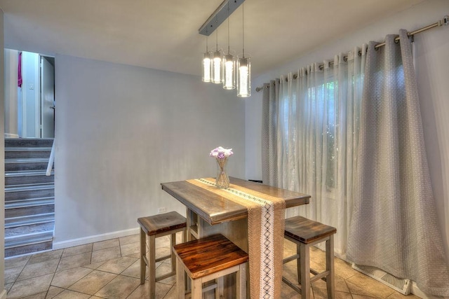 dining room featuring light tile patterned floors