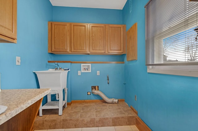 laundry area with washer hookup, light tile patterned floors, cabinets, and hookup for an electric dryer