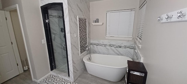 bathroom featuring independent shower and bath and tile walls