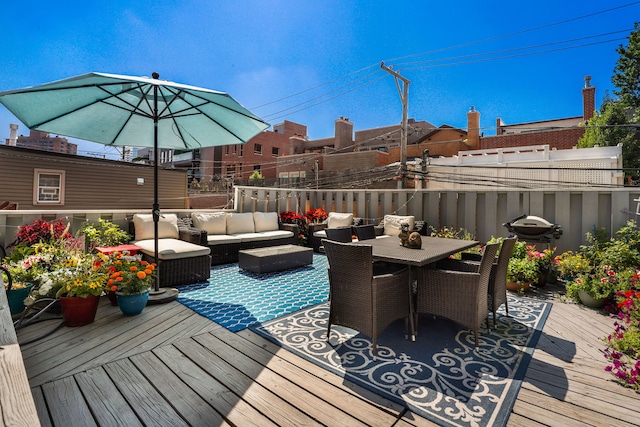 wooden terrace featuring an outdoor hangout area