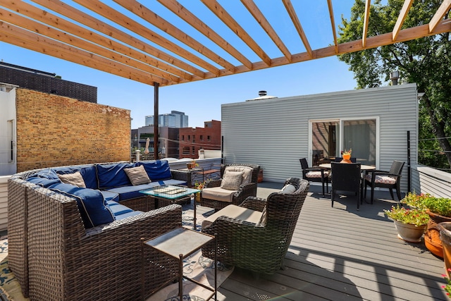 wooden terrace with an outdoor hangout area and a pergola