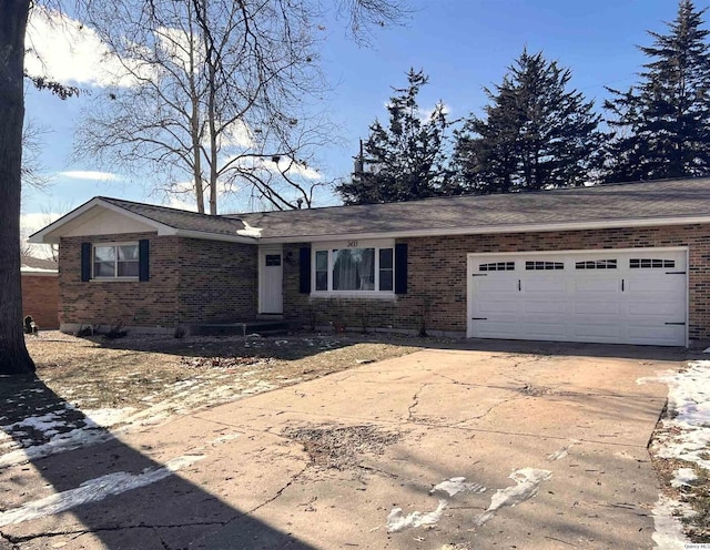 ranch-style house featuring a garage