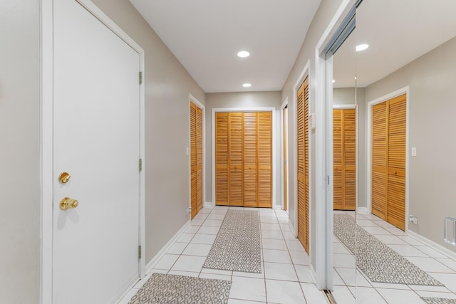 corridor with light tile patterned floors