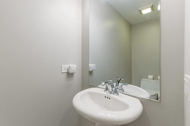 bathroom with sink and toilet