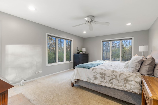 carpeted bedroom featuring ceiling fan