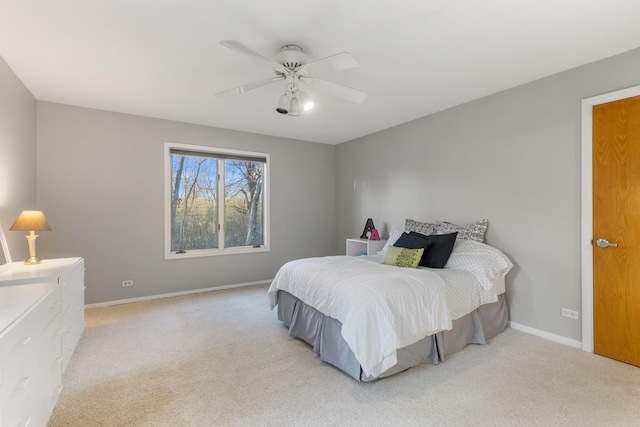 bedroom with light colored carpet and ceiling fan