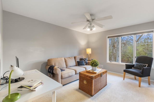 carpeted living room featuring ceiling fan