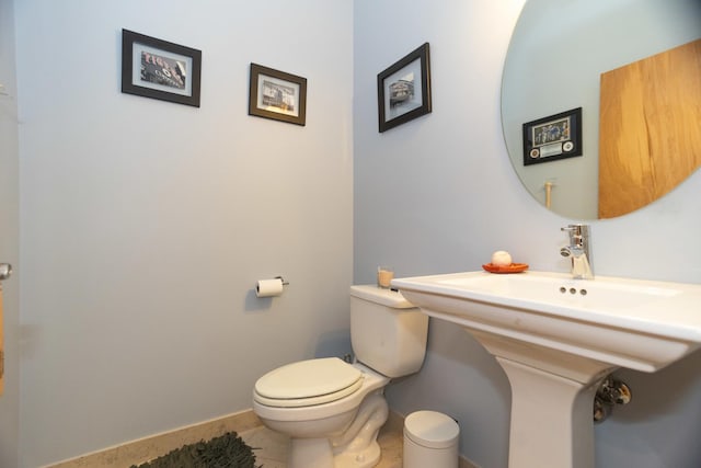 bathroom with tile patterned floors and toilet