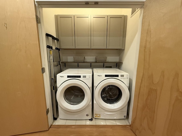 laundry room with cabinets and independent washer and dryer