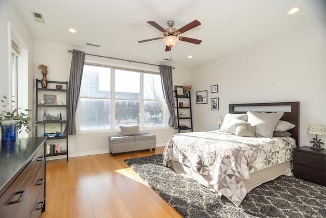 bedroom with light wood-type flooring and ceiling fan