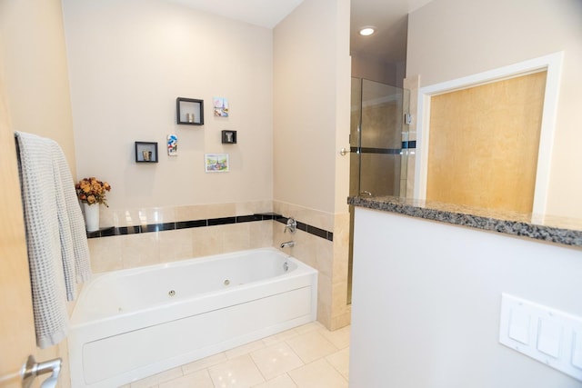 bathroom featuring plus walk in shower and tile patterned floors