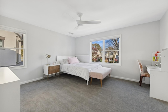 bedroom with ceiling fan and dark carpet