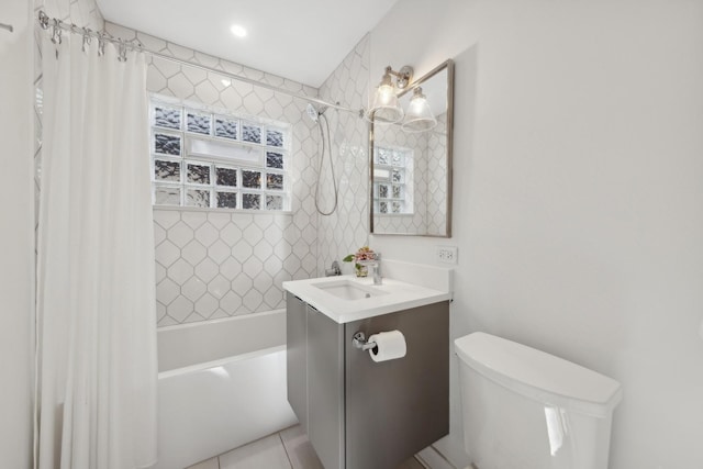 full bathroom featuring shower / bath combination with curtain, vanity, toilet, and tile patterned floors