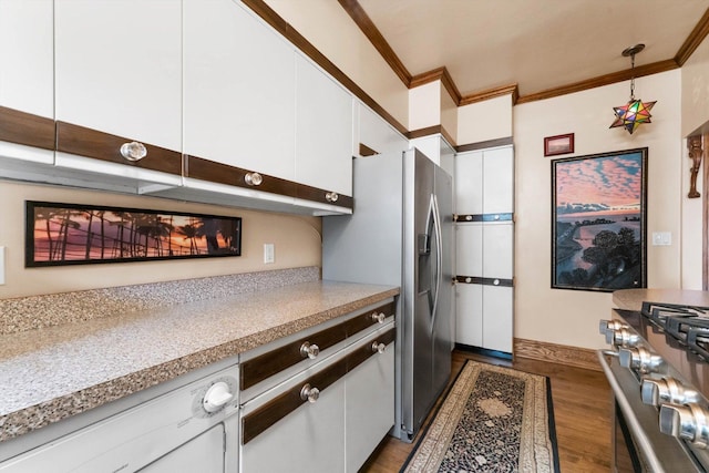 kitchen with ornamental molding, stainless steel appliances, decorative light fixtures, white cabinets, and dark hardwood / wood-style floors