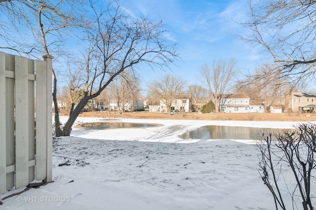 view of yard layered in snow