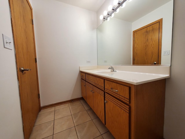 bathroom featuring tile patterned flooring and vanity