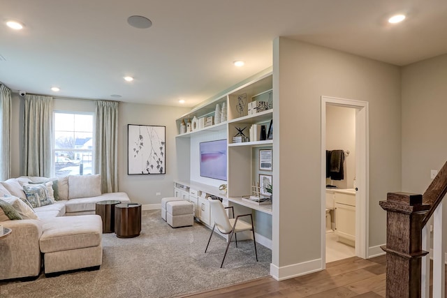 office area with light hardwood / wood-style floors