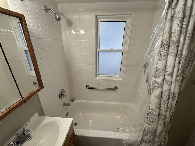 bathroom featuring vanity and shower / tub combo with curtain