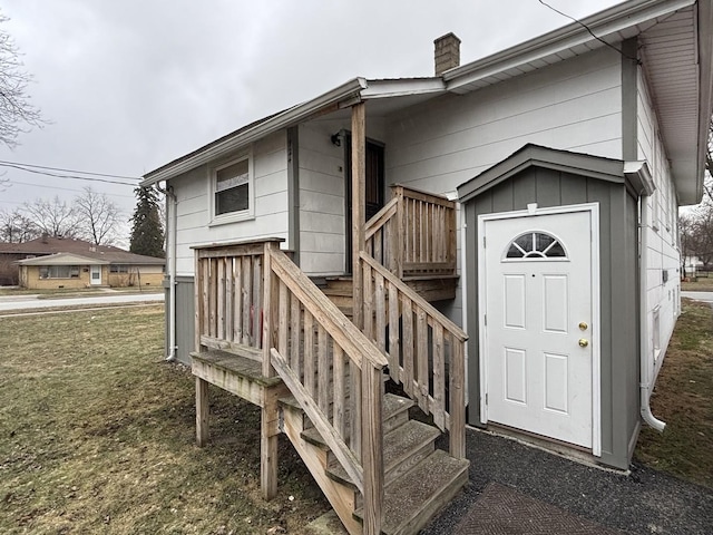 entrance to property with a yard