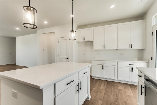 kitchen featuring pendant lighting, white cabinetry, and a kitchen island