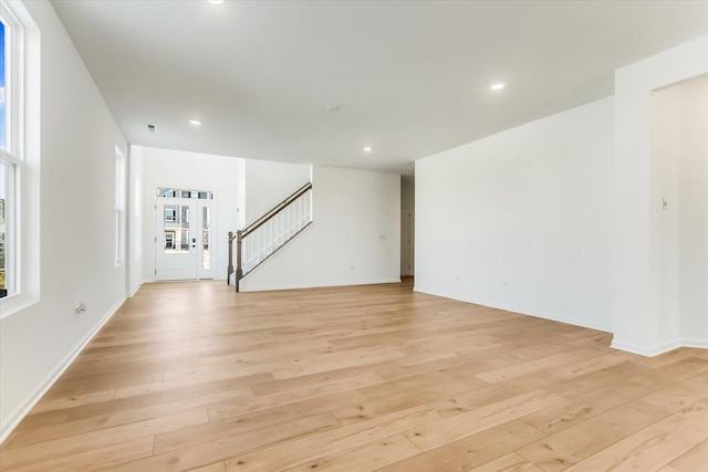 empty room with light hardwood / wood-style floors