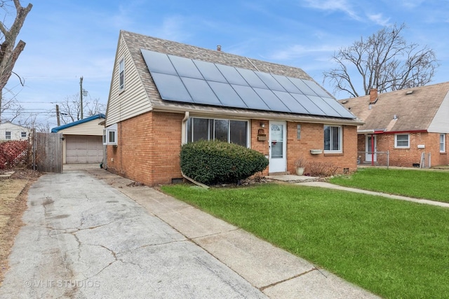 view of front of house featuring solar panels, a garage, an outdoor structure, and a front lawn