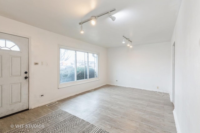 entrance foyer featuring light hardwood / wood-style floors