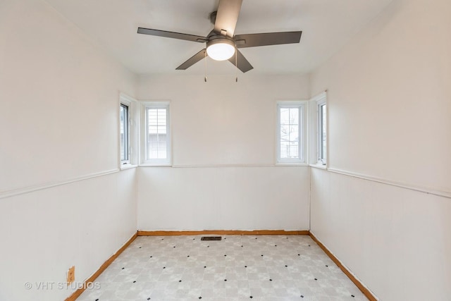 unfurnished room with ceiling fan