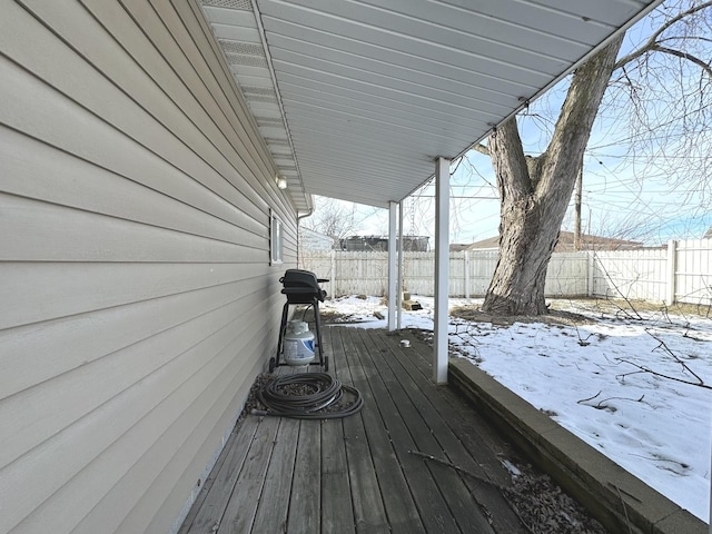 view of snow covered deck